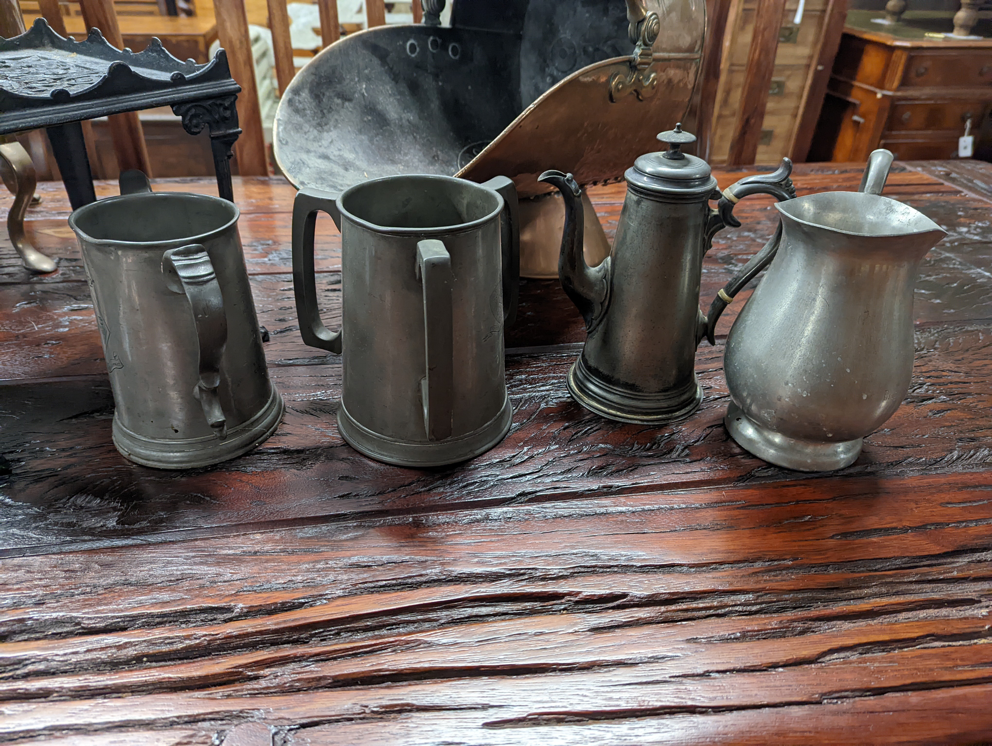 A Victorian copper coal scuttle, a square cast iron trivet, pewter items etc.